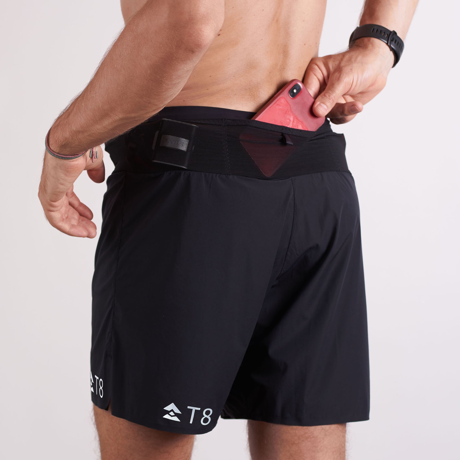 T8-black-V2-Sherpa-shorts-Mens-available-at-red-dot-running-company-worn-backview-with phone pouch